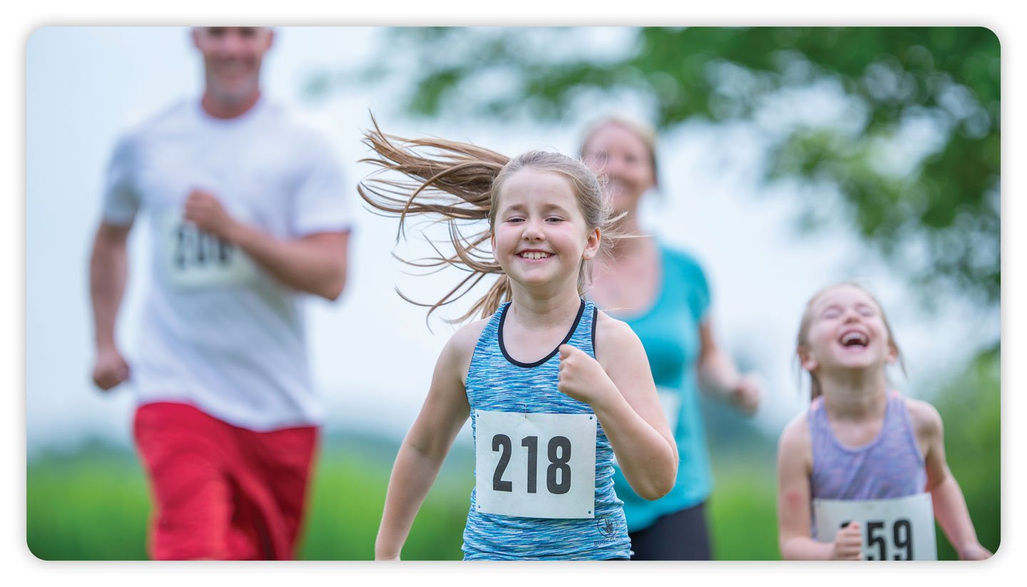 A family participating in a fun run event