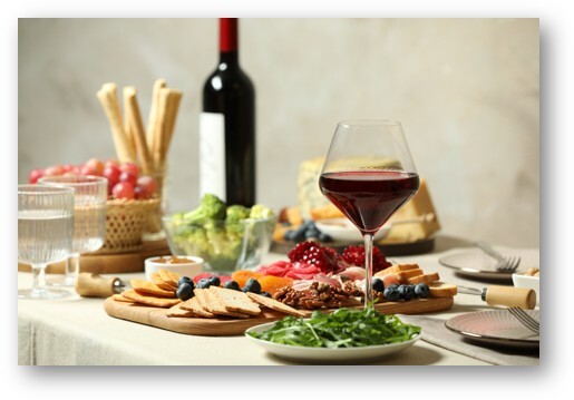 Wine glasses and bottles at a wine tasting event, representing a food and wine silent auction package idea for nonprofit fundraisers